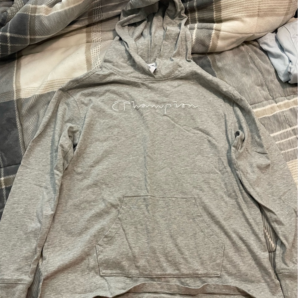 Size Large Champion Long sleeved shirt with hood. New without tags.